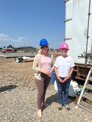 Women in hard hats at the Hammer Event